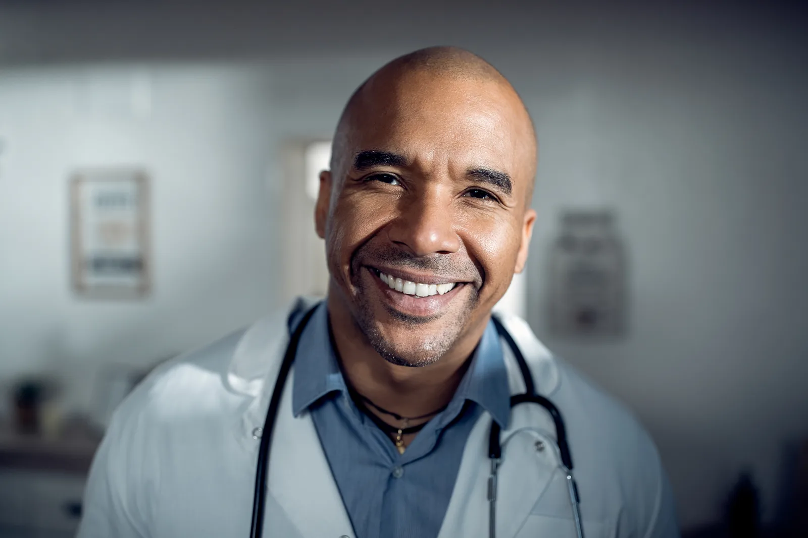 Smiling doctor wearing a white coat and stethoscope