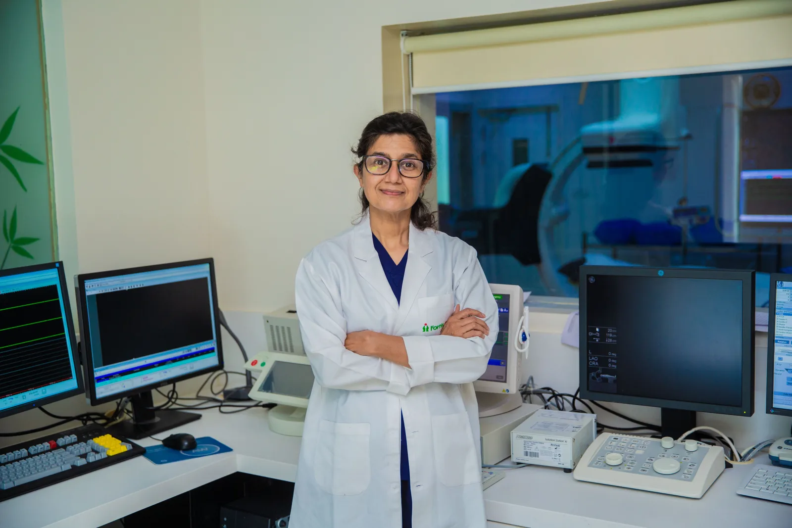 Cardiologist standing in a cardiac imaging control room