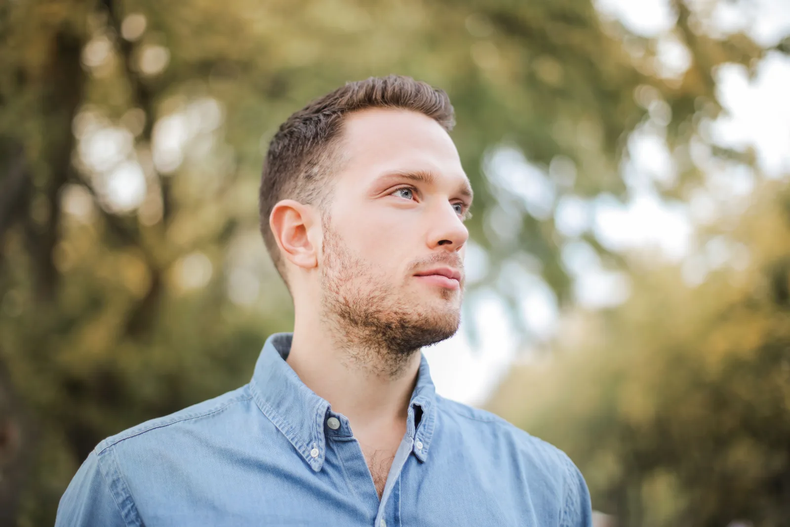 Adult man standing outdoors
